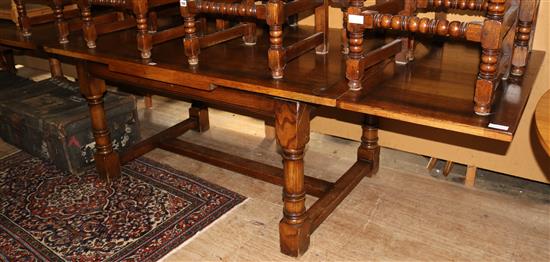 An 18th century style oak draw leaf dining table